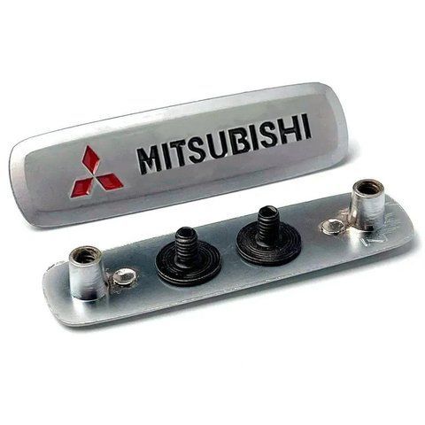 Емблема з логотипом MITSUBISHI для автокилимків АЛЮМІНІЙ (65x18x2мм) 179402 фото