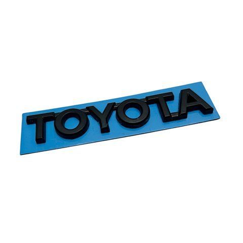 Емблема напис TOYOTA чорна 75х12 мм пластик (на скотчі) 185226 фото
