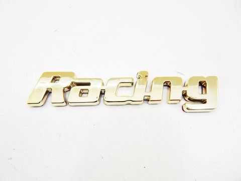 Емблема напис Racing (Золото) 107х20мм (на скотчі) 133953 фото